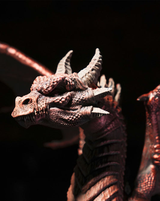 Close-up of a detailed dragon figurine with a dark background