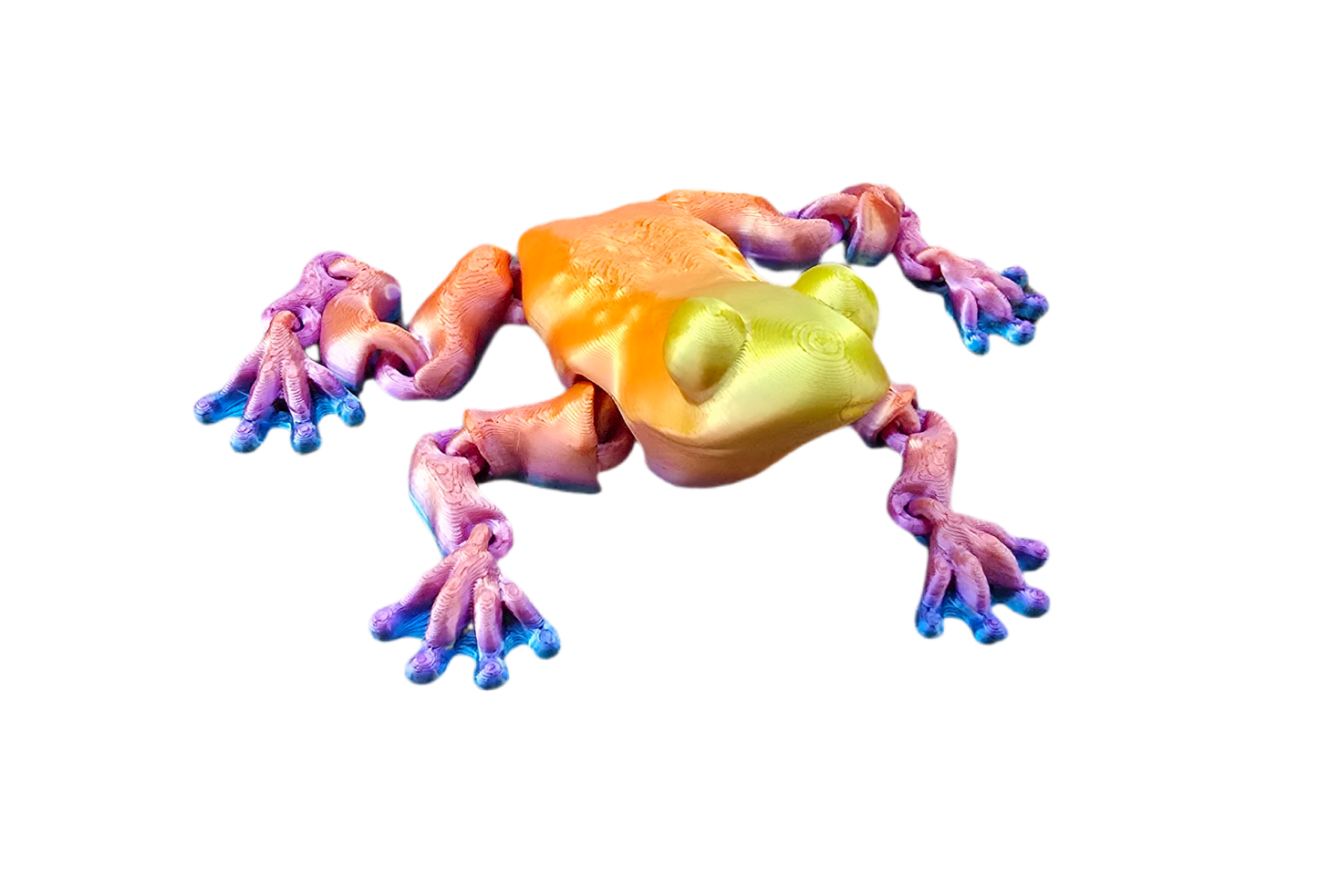 Colorful frog figurine on a white background