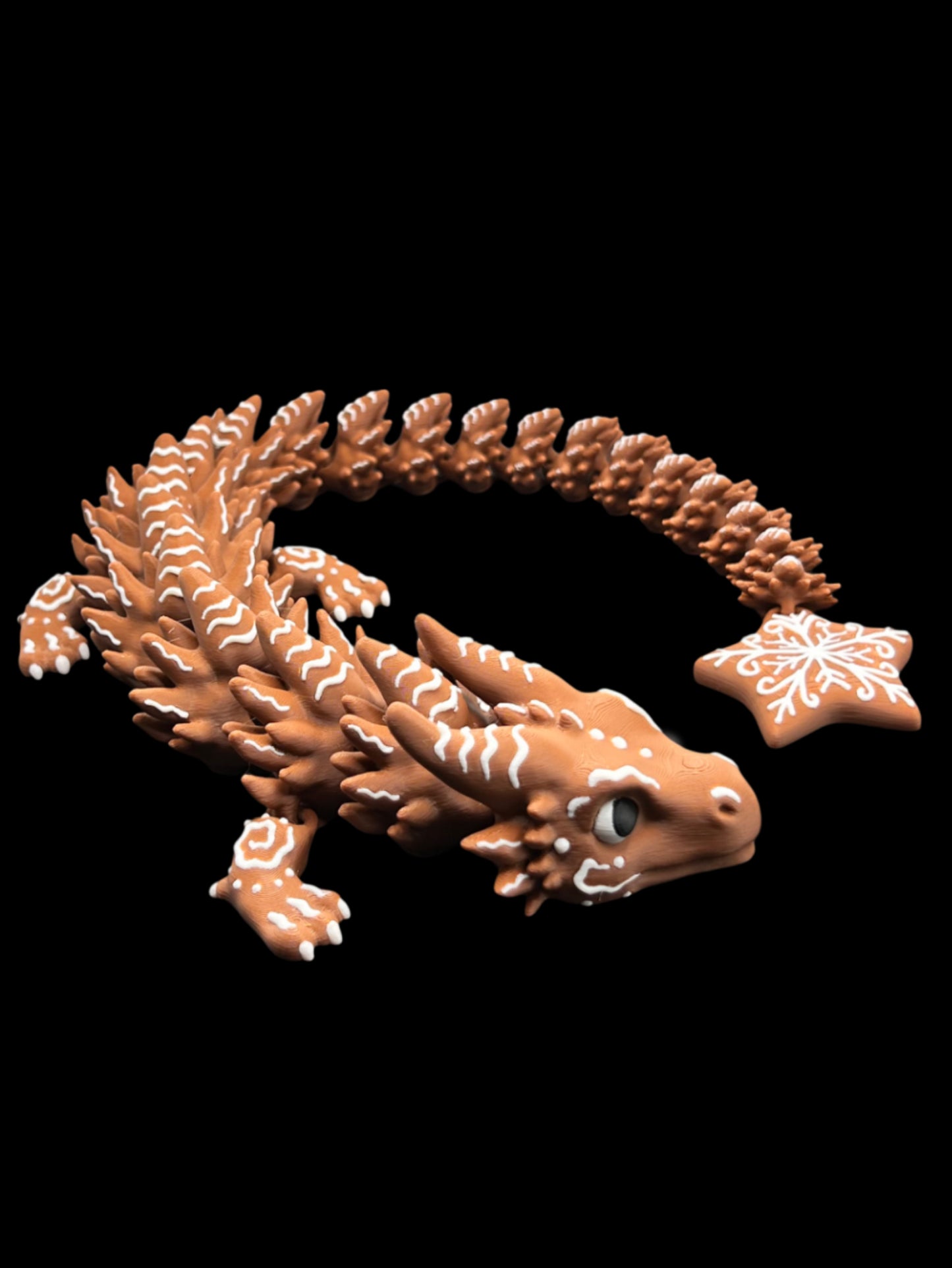 Brown lizard figurine with a star-shaped object on a black background