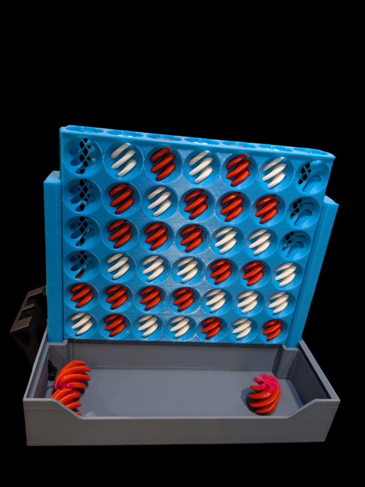 3D printed Connect 4 Vortex Fidget Game, compact foldable board with self-separating stones, shown open and closed, vibrant red and yellow colors