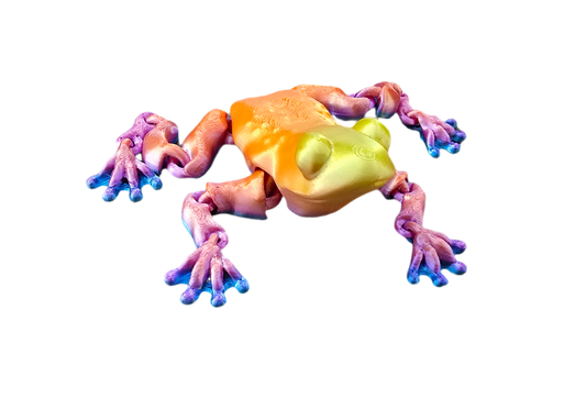 Colorful frog figurine on a white background