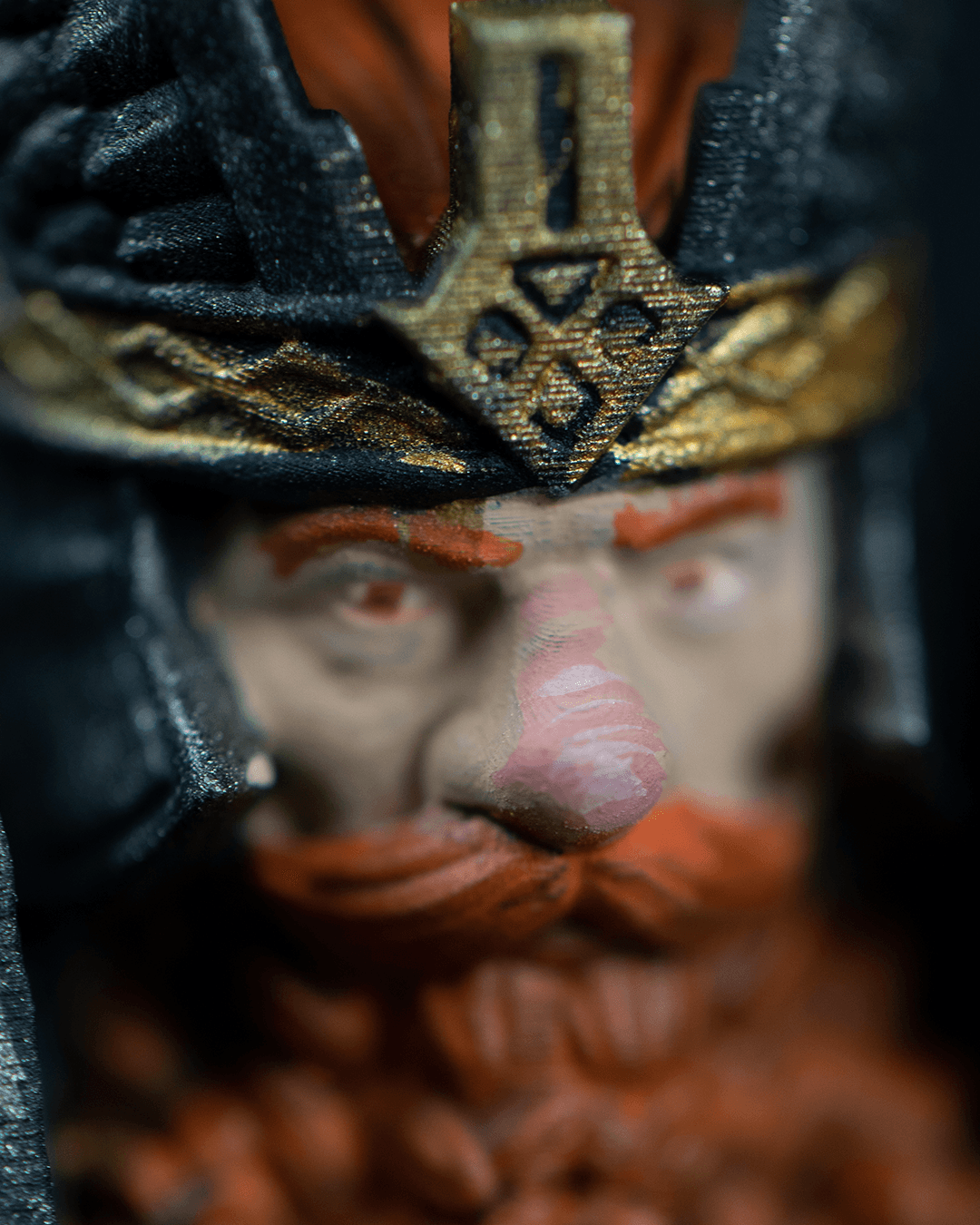 Close-up of a character with detailed armor and face paint, possibly from a fantasy or historical context.