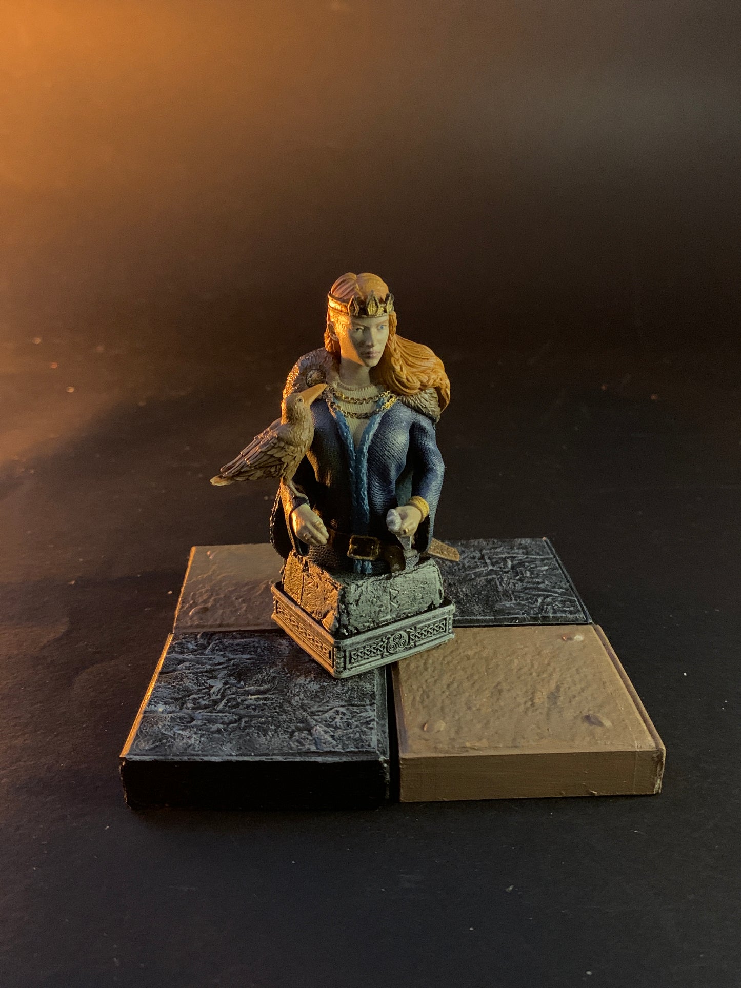Statue of a person with a book on a dark background chess queen
