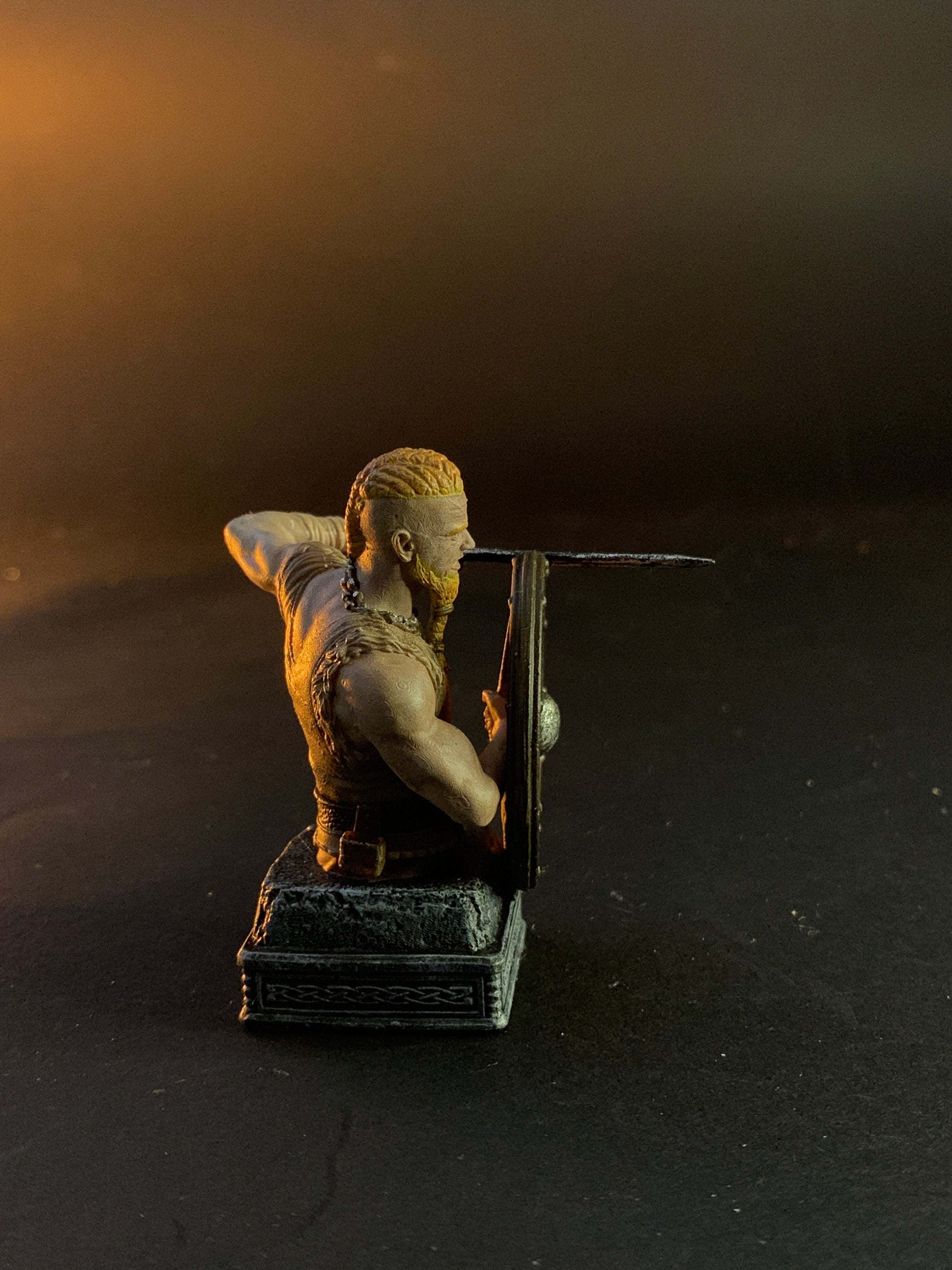 Small chess figurine of a person holding a suitcase against a dark background