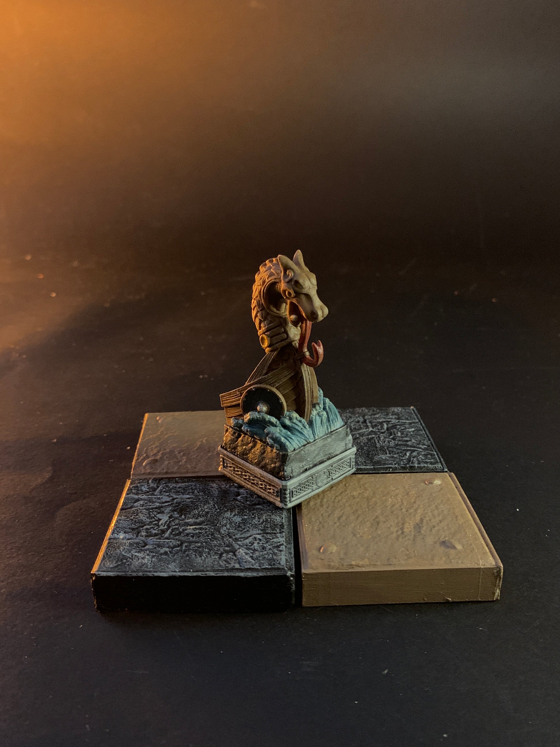 Metallic sculpture on a dark background chess horse