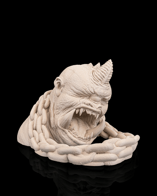 White ceramic sculpture of a creature with chains on a black background