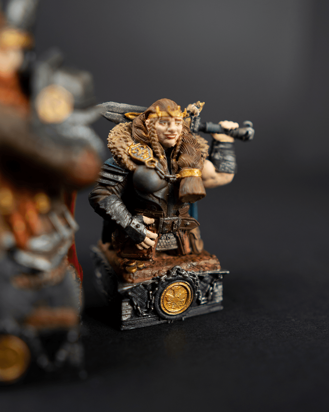 Miniature figurine of a warrior in ornate armor with a dark background