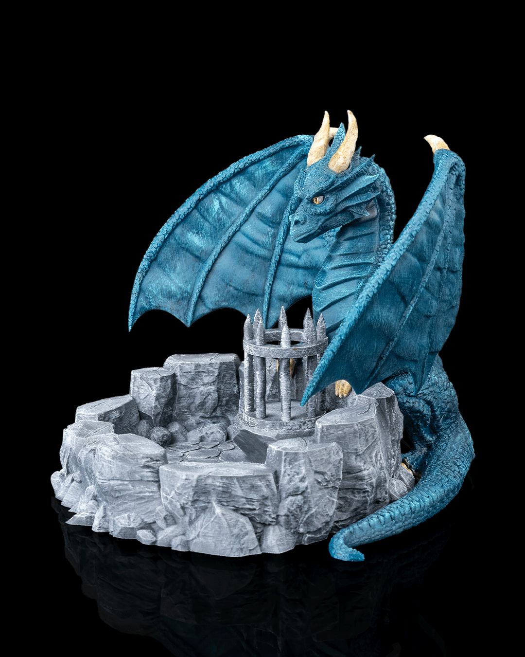 Blue dragon guarding a castle on a rocky outcrop against a black background