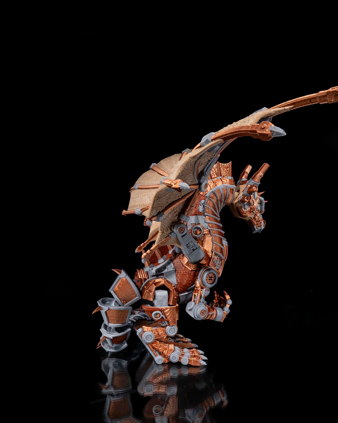 Mechanical dragon figurine on a black background