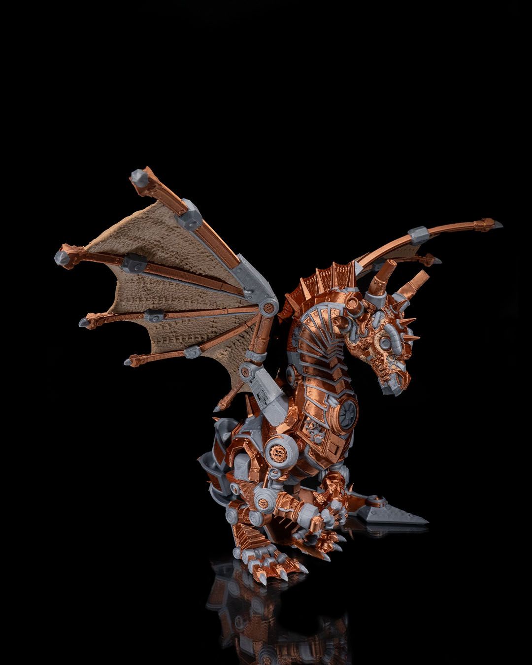 Mechanical dragon figurine on a black background