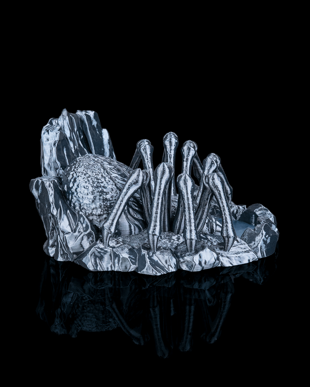 Spider Dice Tower Crystal sculpture of a spider on a black background