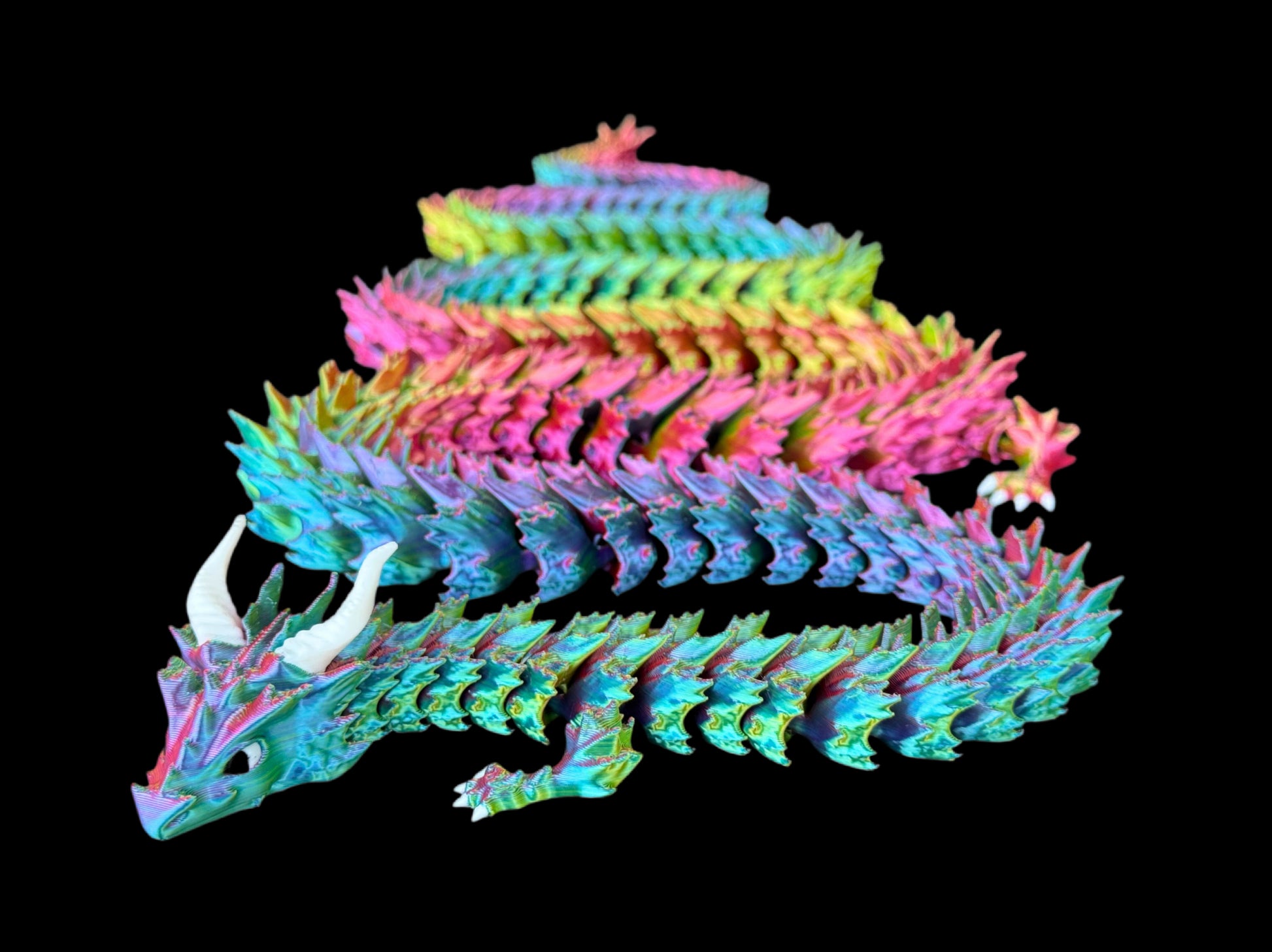 Colorful dragon sculpture on a black background